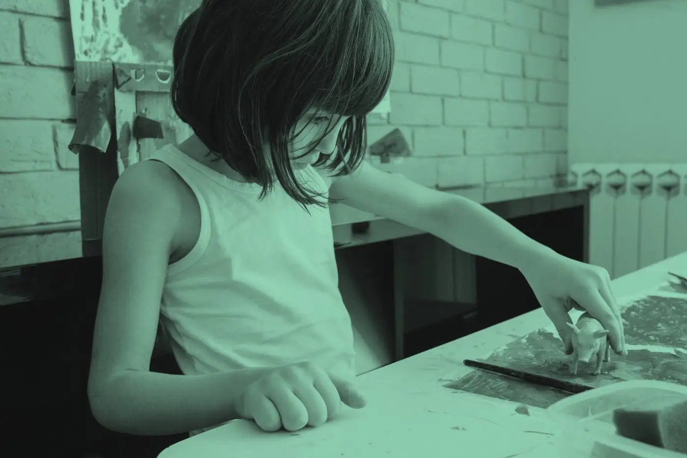 A young person working on a hands-on craft project